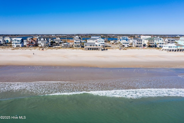 drone / aerial view with a view of the beach and a water view