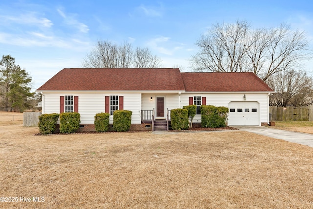 ranch-style house featuring a front yard and a garage