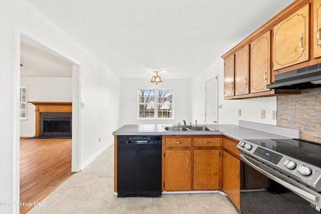 kitchen with kitchen peninsula, light tile patterned floors, stainless steel electric range oven, sink, and black dishwasher