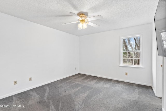 unfurnished room featuring a textured ceiling, dark colored carpet, and ceiling fan