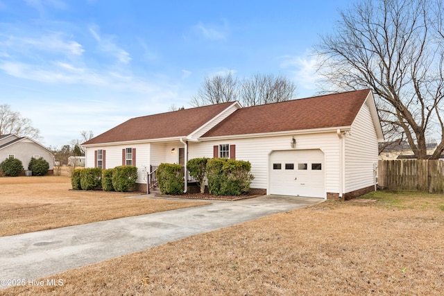 ranch-style house featuring a front yard and a garage