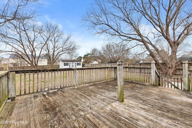 wooden terrace with a storage shed