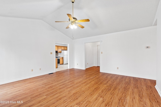 unfurnished living room with vaulted ceiling, ceiling fan, and light hardwood / wood-style floors