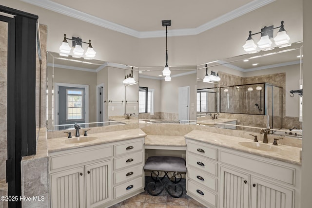 bathroom with a shower with shower door, a healthy amount of sunlight, and ornamental molding