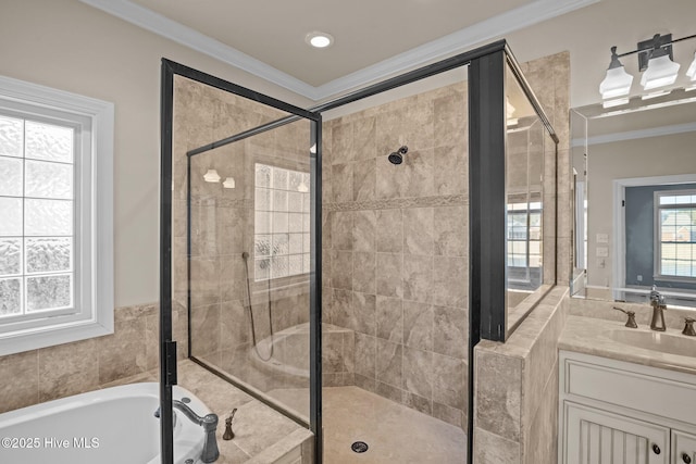 bathroom with vanity, ornamental molding, and shower with separate bathtub