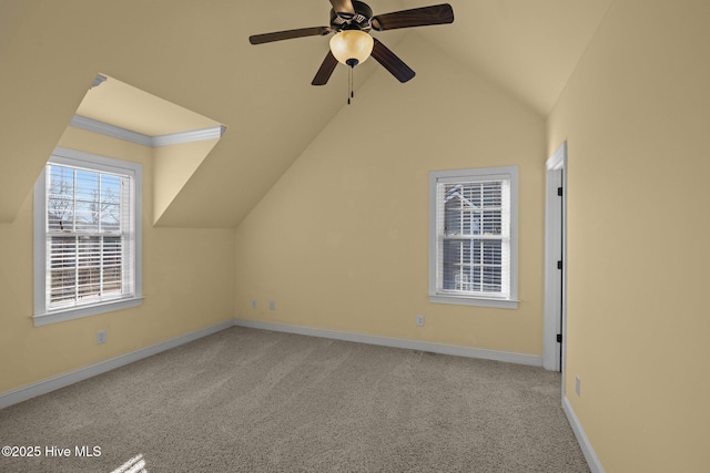 bonus room featuring ceiling fan, light carpet, and vaulted ceiling