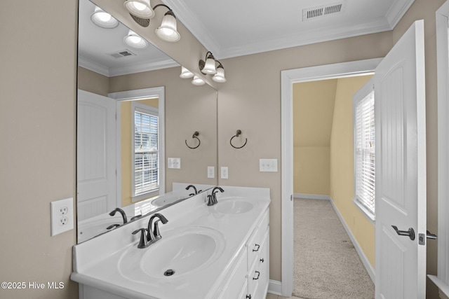 bathroom featuring crown molding and vanity