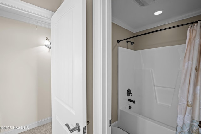 bathroom with ornamental molding and shower / tub combo with curtain