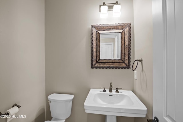 bathroom with sink and toilet