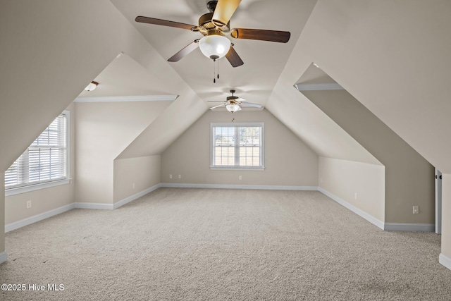 bonus room with ceiling fan, light colored carpet, and lofted ceiling