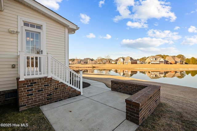 view of patio featuring a water view