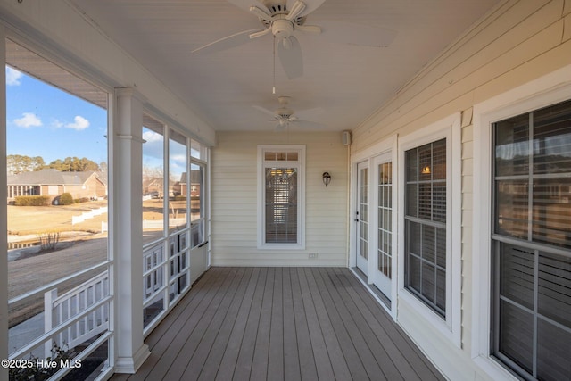 sunroom featuring ceiling fan