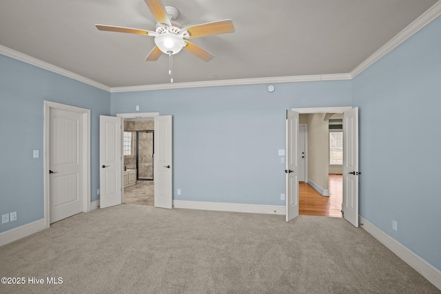 unfurnished bedroom featuring light carpet, ceiling fan, and crown molding