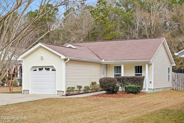 single story home featuring a front yard and a garage