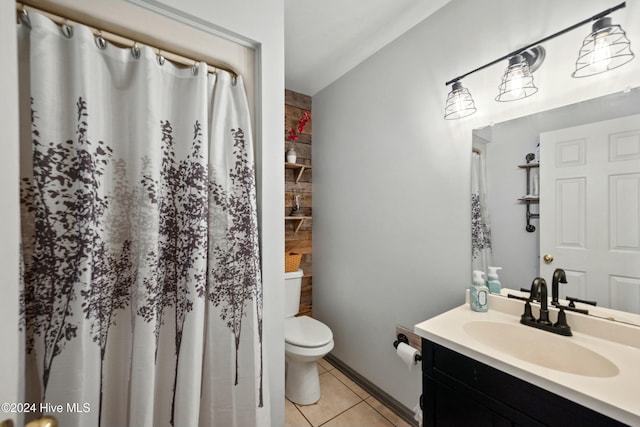 bathroom with a shower with shower curtain, vanity, toilet, and tile patterned flooring