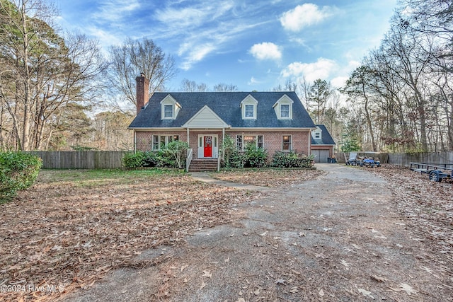 cape cod-style house with a garage