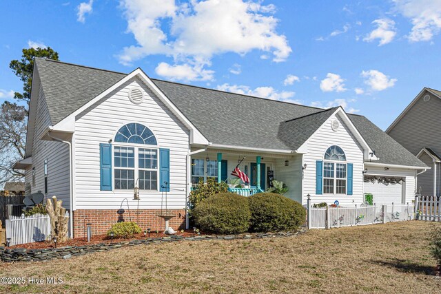 ranch-style house featuring covered porch and a garage