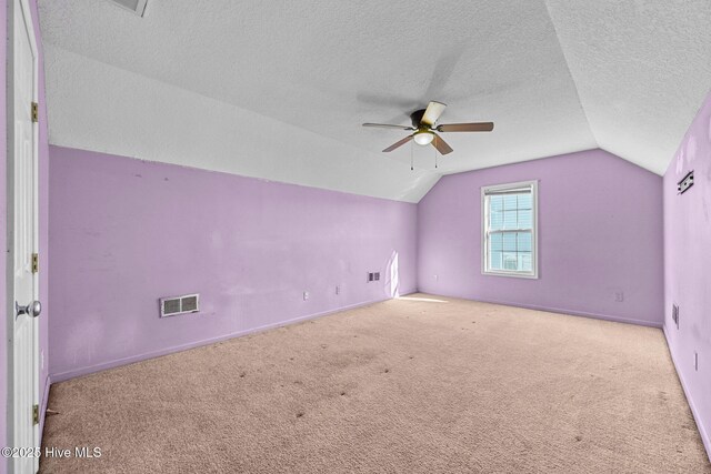 interior space with dark wood-type flooring and a textured ceiling