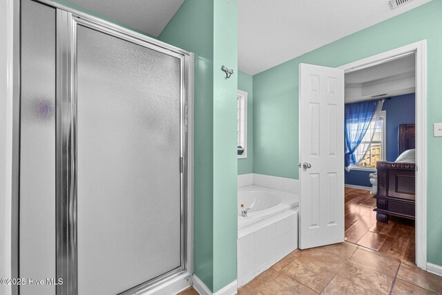 bedroom featuring dark wood-type flooring, a raised ceiling, ceiling fan, and crown molding