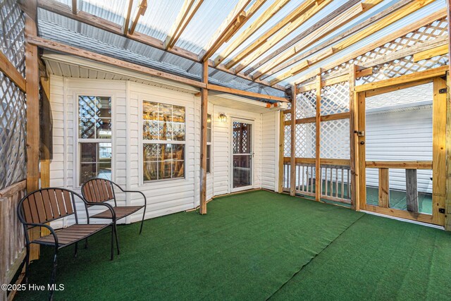 ranch-style home featuring covered porch and a front yard