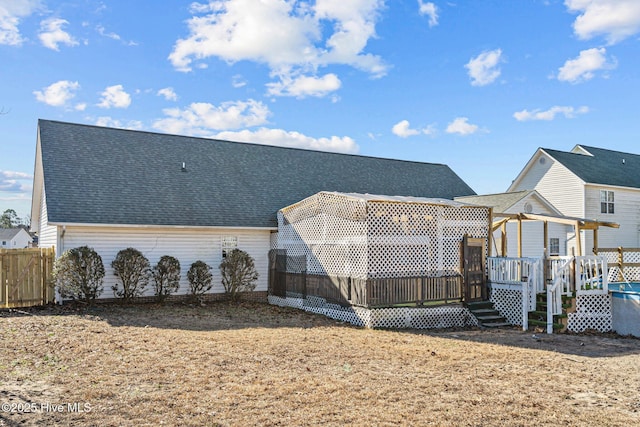 rear view of property with a deck