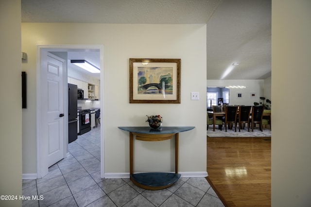 hallway with light tile patterned flooring