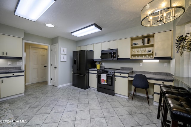 kitchen featuring white cabinets, black fridge with ice dispenser, an inviting chandelier, and range with electric stovetop