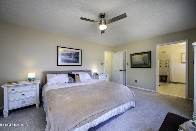 bedroom featuring ceiling fan, light colored carpet, and a textured ceiling