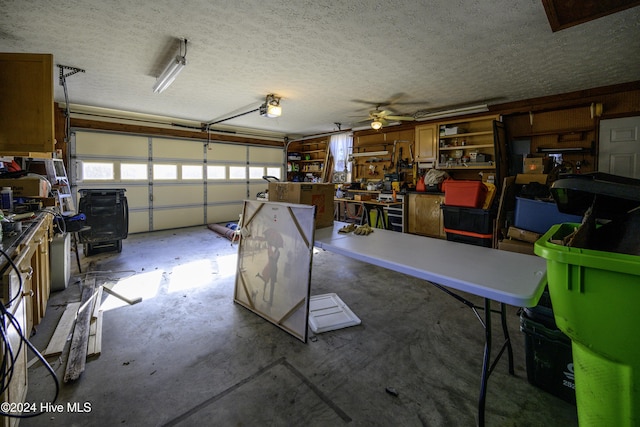 garage with ceiling fan and a garage door opener