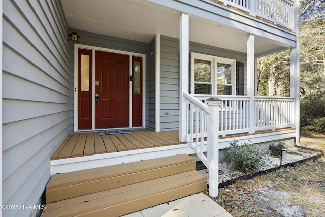 view of exterior entry featuring a porch