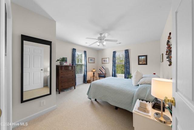 carpeted bedroom featuring ceiling fan