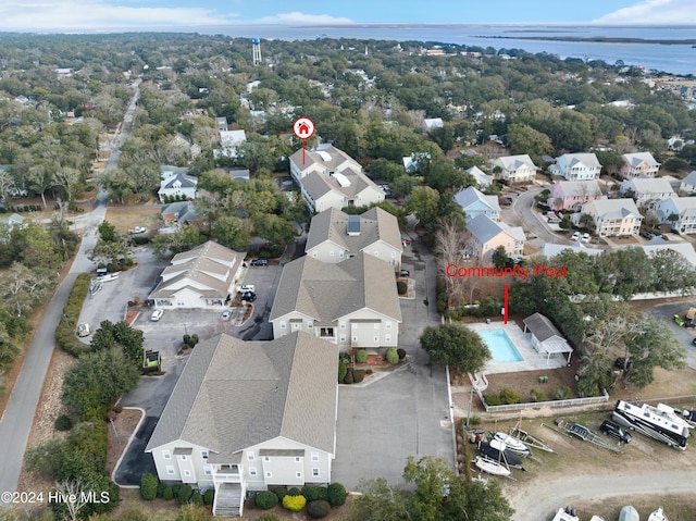 birds eye view of property with a water view