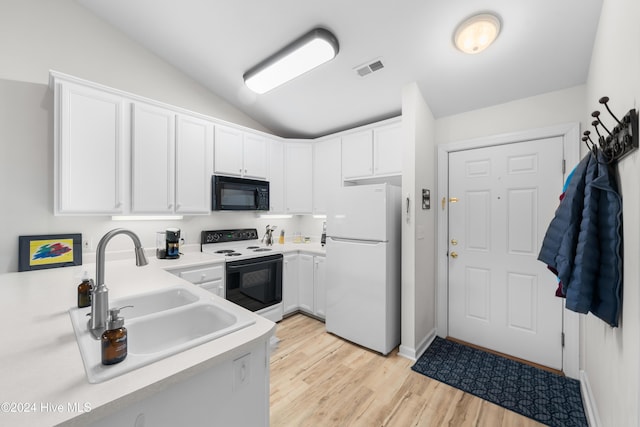 kitchen featuring white appliances, white cabinets, sink, light hardwood / wood-style flooring, and vaulted ceiling