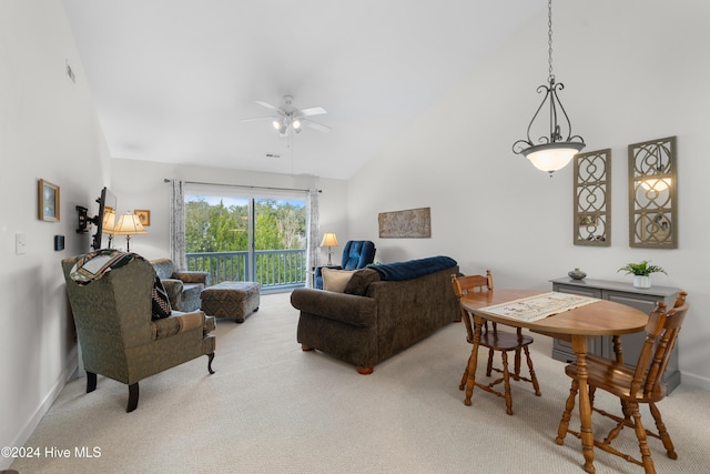 living room with carpet, ceiling fan, and high vaulted ceiling