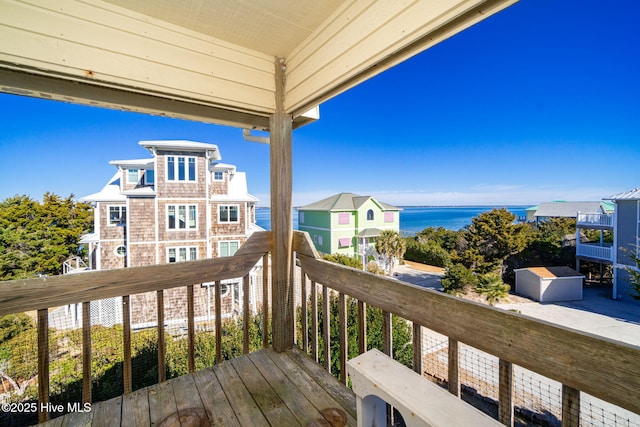 balcony featuring a water view