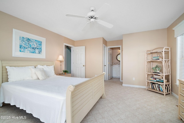 carpeted bedroom with connected bathroom and ceiling fan