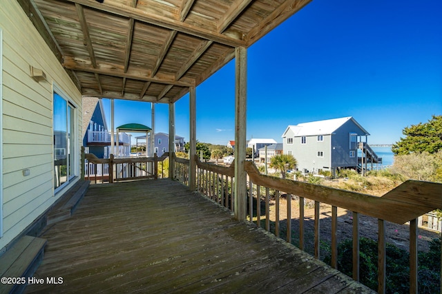 wooden deck featuring a water view