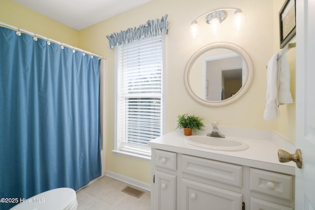 bathroom with tile patterned floors, vanity, and toilet