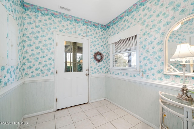 tiled foyer with a wealth of natural light