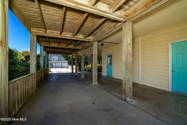 view of patio with a garage and an outdoor structure