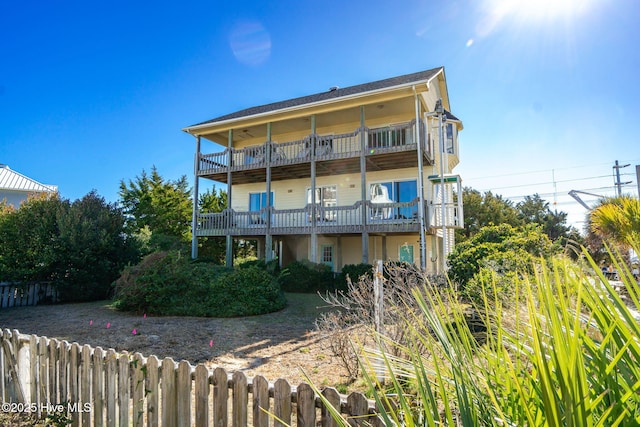 back of property with a balcony