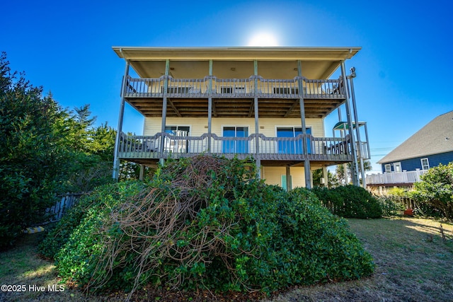 back of property with a balcony