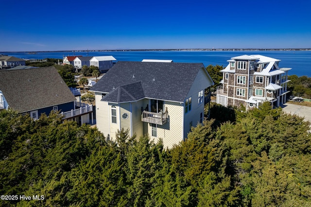 birds eye view of property with a water view