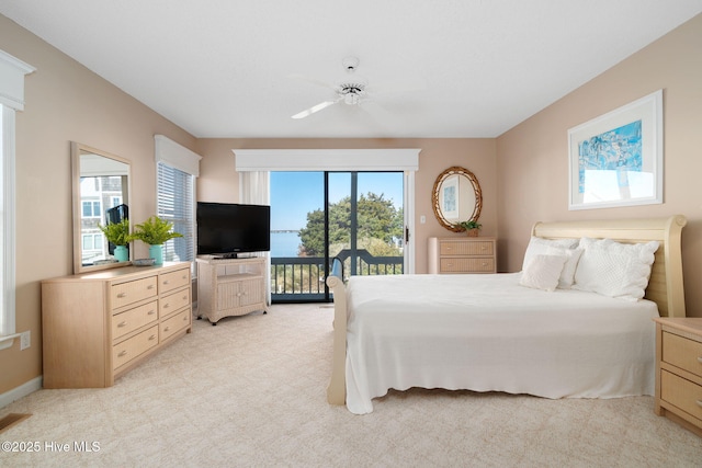 carpeted bedroom featuring ceiling fan and access to outside