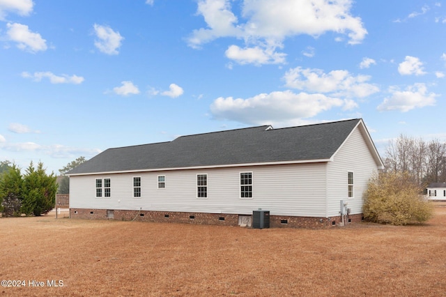 back of property featuring central AC unit