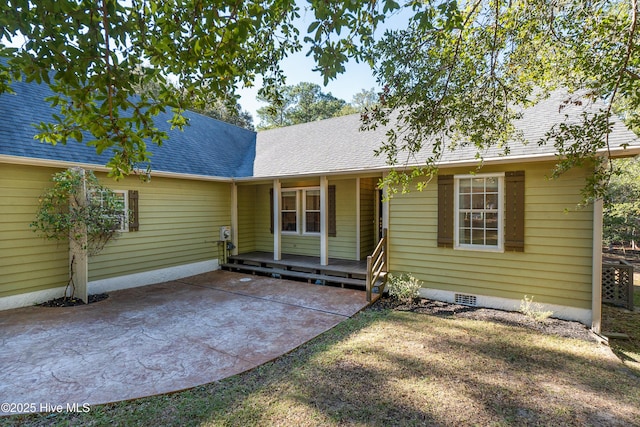 view of front of property with a shingled roof and crawl space