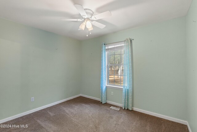 unfurnished sunroom featuring ceiling fan