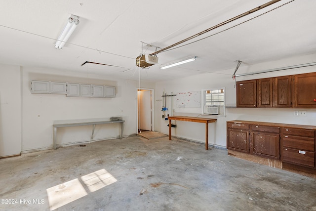 garage with a garage door opener and cooling unit