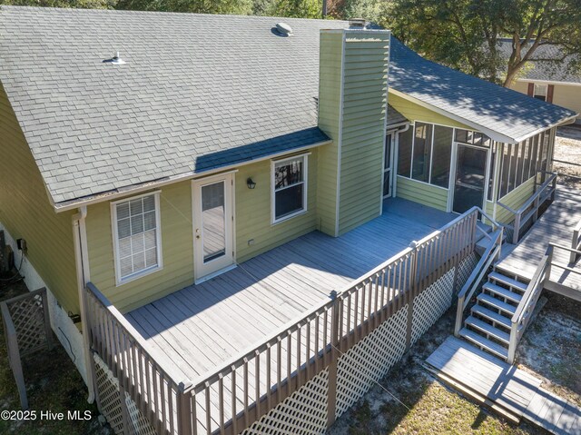 view of side of property featuring a sunroom