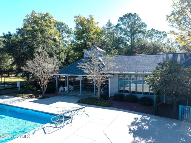 view of yard featuring a wooden deck and a sunroom